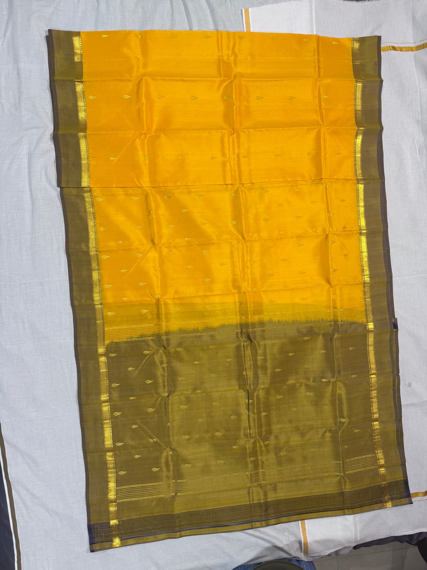 Kanchivaram  Soft silk yellow saree with small border
